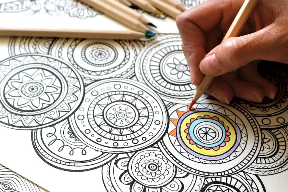 Image of a person using colored pencils.