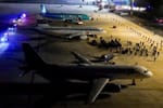 Image of three airplanes parked on a tarmac in El Salvador