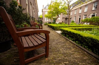 Picture of a rocking chair in the courtyard of a senior community