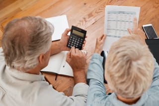 Picture of a senior couple calculating mortgage interest