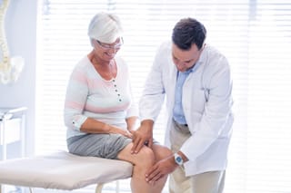 Image of a woman getting a physical examination at the doctors