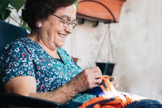 Image of a senior woman working on crochet