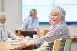 Image of a group of seniors in a class for lifelong learning