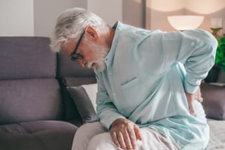 Image of a senior man with pain from chronic kidney disease