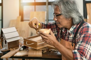 Picture of a senior man in his woodworking shop