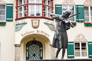 Image of a status of Wolfgang Amadeus Mozart in front of Rathaus St Gilgen in Austria