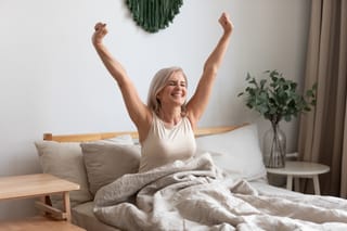 Picture of a senior woman waking up after a good night's sleep