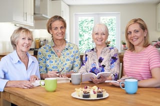 Picture of a group of women conducting a book club meeting