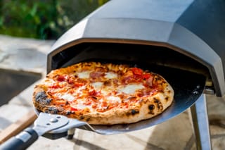 Picture of a freshly baked pizza made in a home pizza oven 