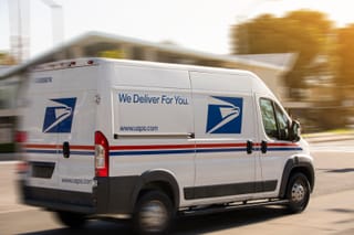 Image of USPS van in motion