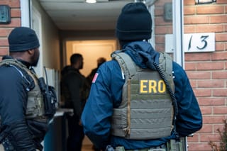 Photo of ICE agents arresting illegal aliens