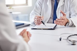 Photo of a doctor doing paperwork 