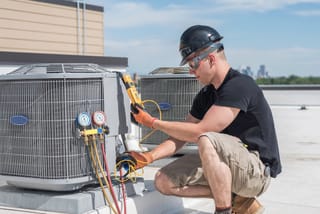 Photo of an HVAC technician 