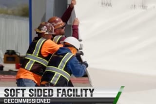 Picture of workers taking down an illegal immigrant center in San Diego 