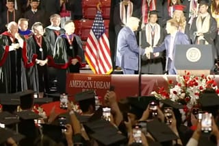Picture of President Trump shaking hands with Nick Saban at Alabama 2025 graduation ceremony
