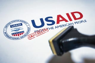 US Aid logo with CANCELLED stamped across it in red