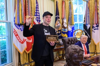 Picture of Elon Musk with President Trump in the Oval Office receiving a key to the White House