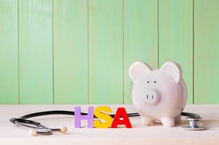 Picture of a piggy bank, stethoscope, and the letters HSA