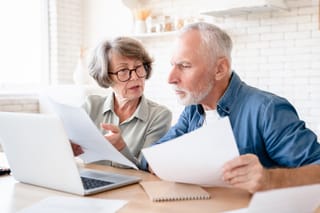 Picture of a senior couple reviewing their finance