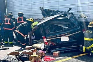 Picture of a car that crashed into a semi trailer