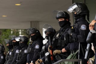 Picture of several ICE officers standing in a line 