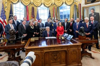Picture of President Trump in the Oval Office during a press conference 