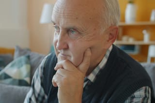 Image of an older man in thought