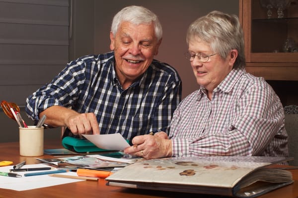 Image of a senior couple scrapbooking