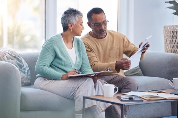 Image of a senior couple evaluating their homeowners insurance