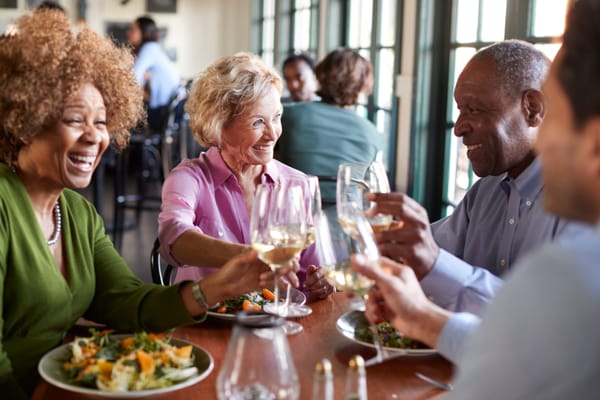 Picture of two senior couples eating at a restaurant