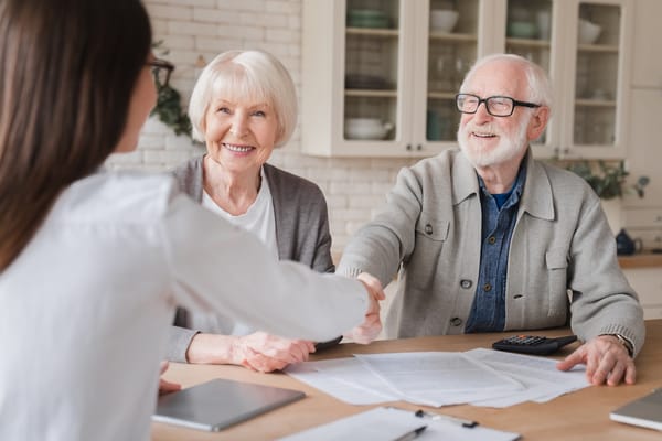 Picture of a senior couple obtaining insurance