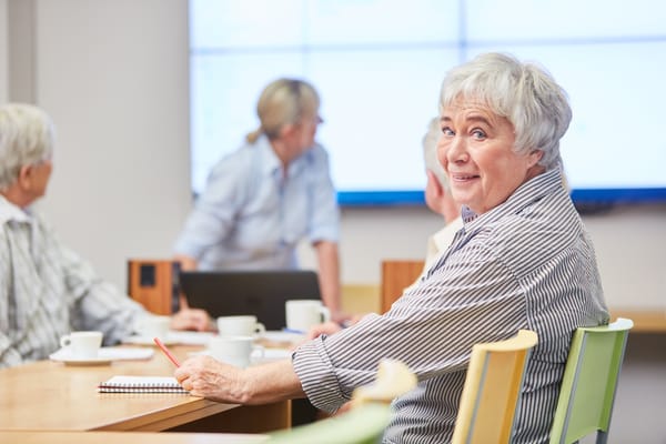 Image of a group of seniors in a class for lifelong learning