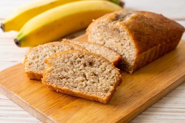 Image of a homemade banana bread and bananas