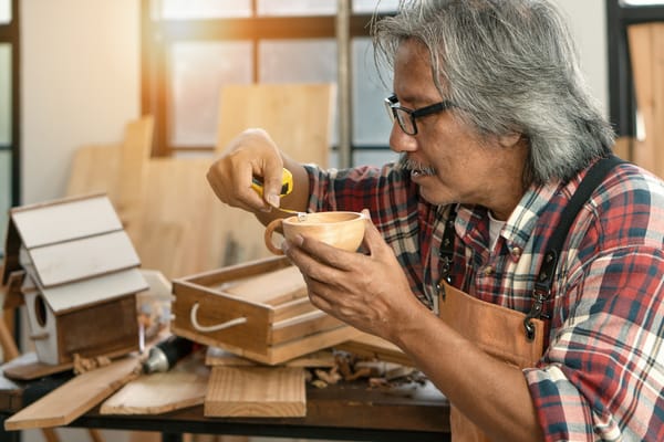 Picture of a senior man in his woodworking shop