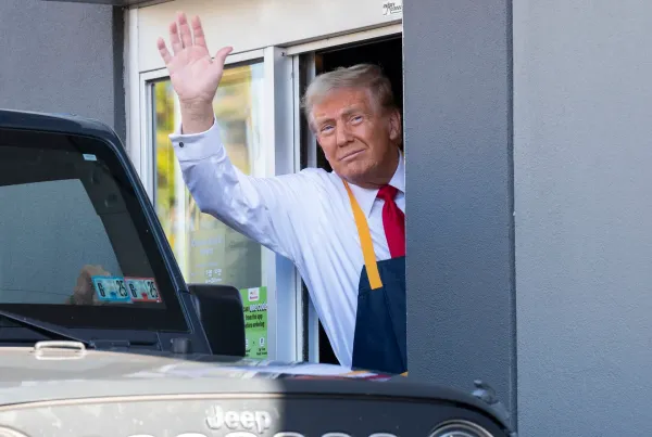 Photo of Donald Trump working at a McDonalds drive through window