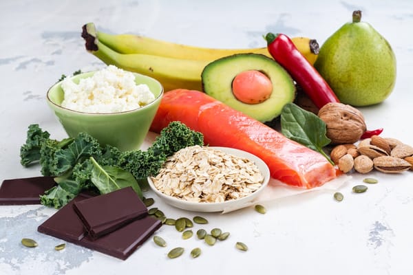 Picture of brain foods including salmon, dark chocolate, avocado, and nuts