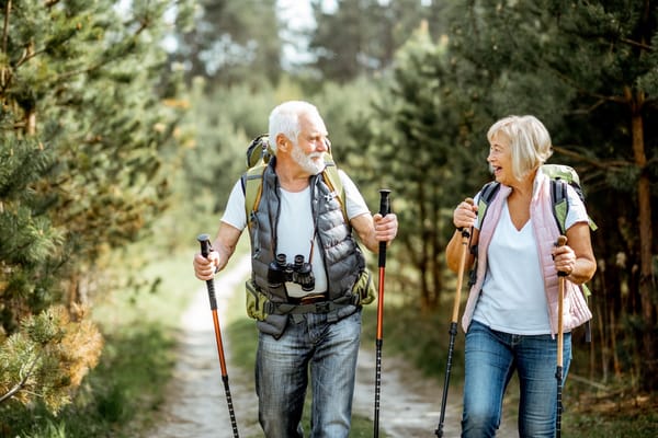 Picture of a senior couple hiking in the woods