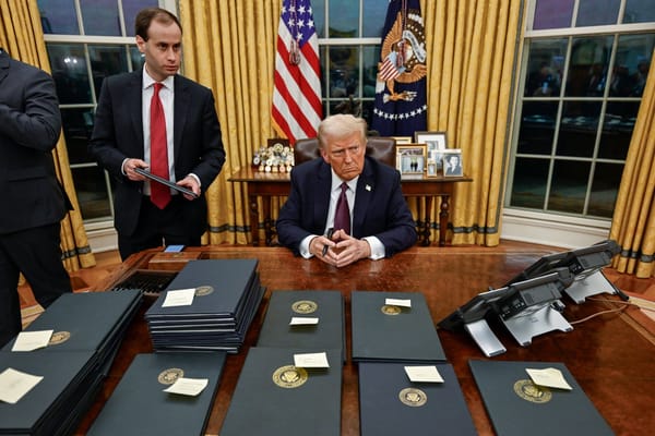 Photo of Trump signing executive orders  