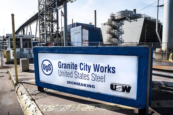 Image of sign for Granite City Works in front of steel plant