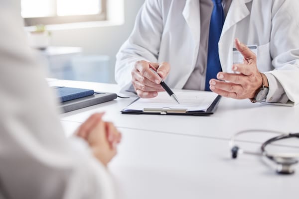 Photo of a doctor doing paperwork 
