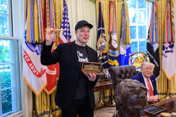 Picture of Elon Musk with President Trump in the Oval Office receiving a key to the White House