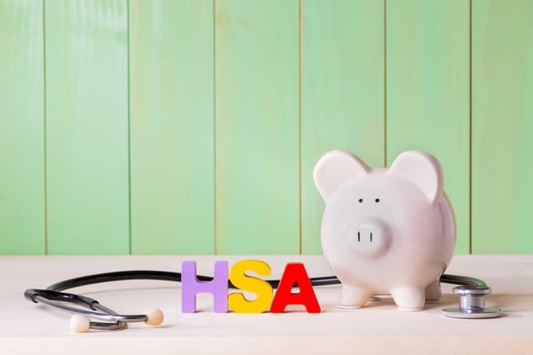 Picture of a piggy bank, stethoscope, and the letters HSA