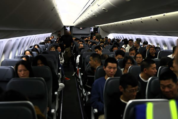 Picture of illegal immigrants on a plane being deported to China 