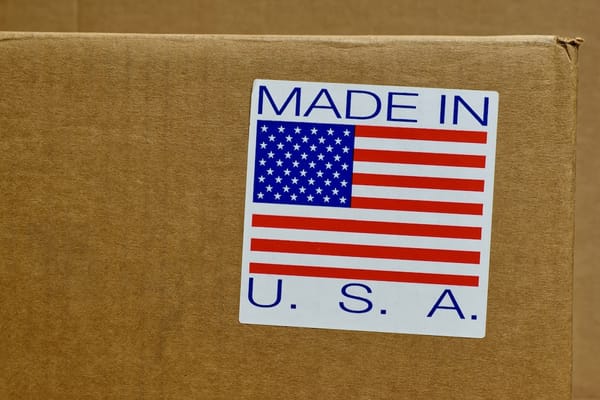 Picture of a shipping box with a sticker saying Made in USA along with a U.S. Flag