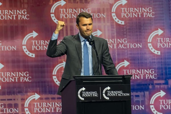 Picture of Charlie Kirk of Turning Point USA speaking at a lectern