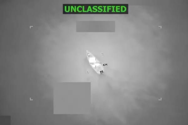 Picture of a drug running boat just before it is destroyed