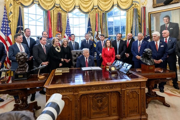 Picture of President Trump in the Oval Office during a press conference 
